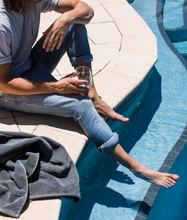 Pool Coping Other A man sitting on pool coping